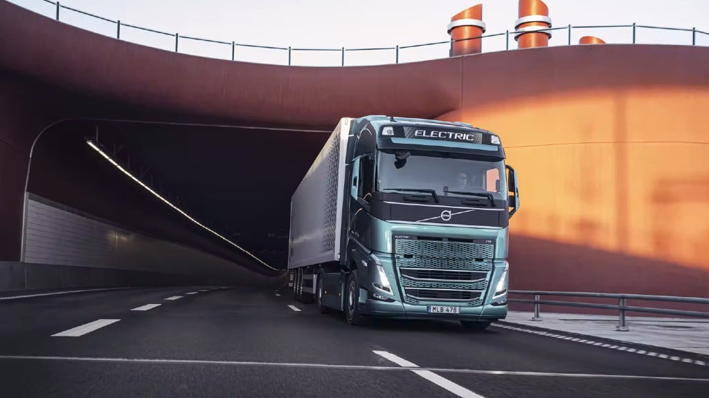 An electric truck drives out from a tunnel