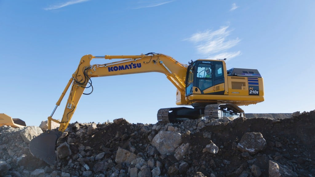 An electric excavator working on top of a rock pile.