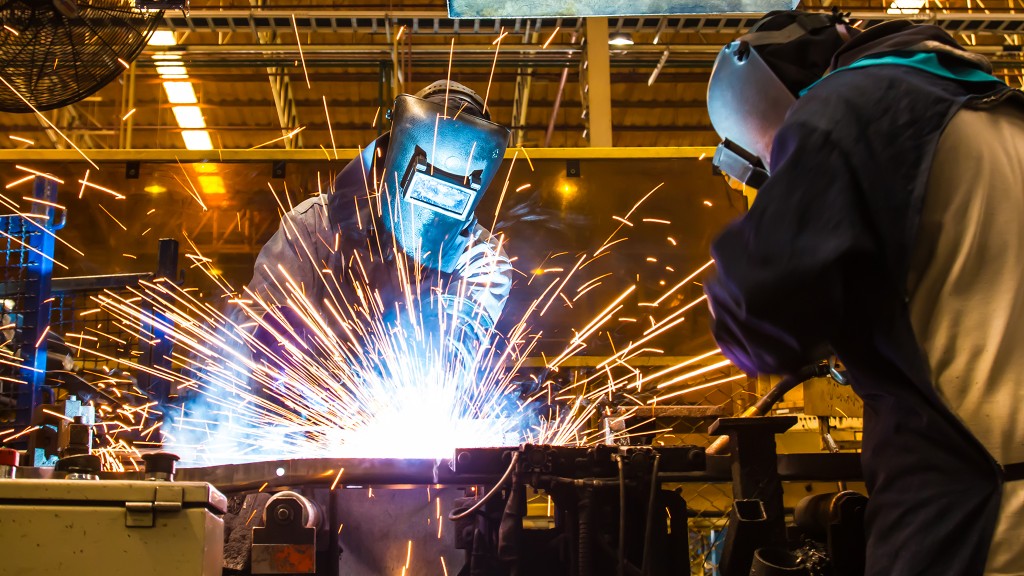 Welders working in a manufacturing shop
