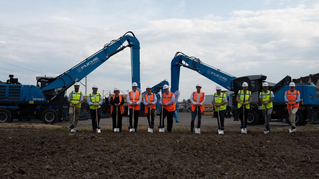 A group of people break ground on a new building