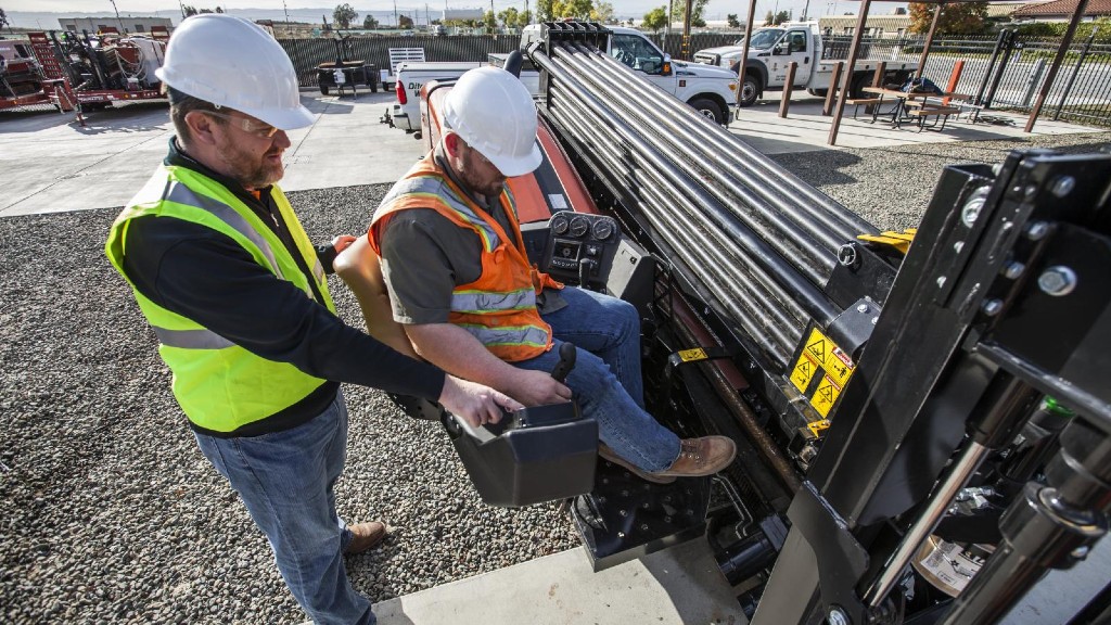 An HDD operator gets training instruction