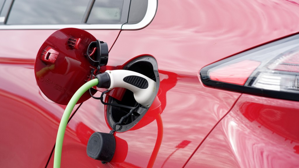 An electric vehicle charges