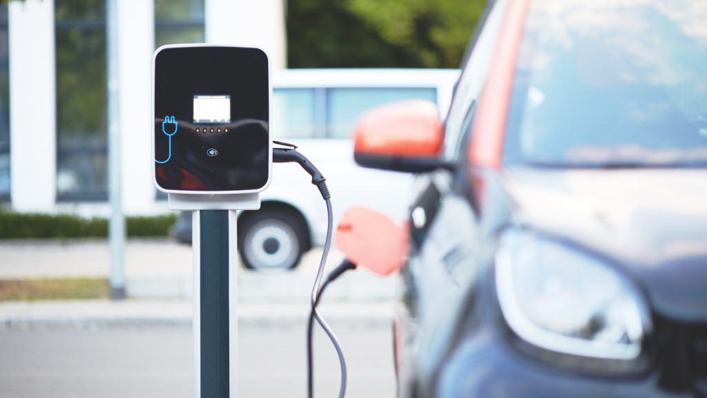 An EV charges while parked on the side of a road