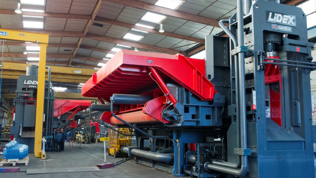 A scrap shear operates inside a facility