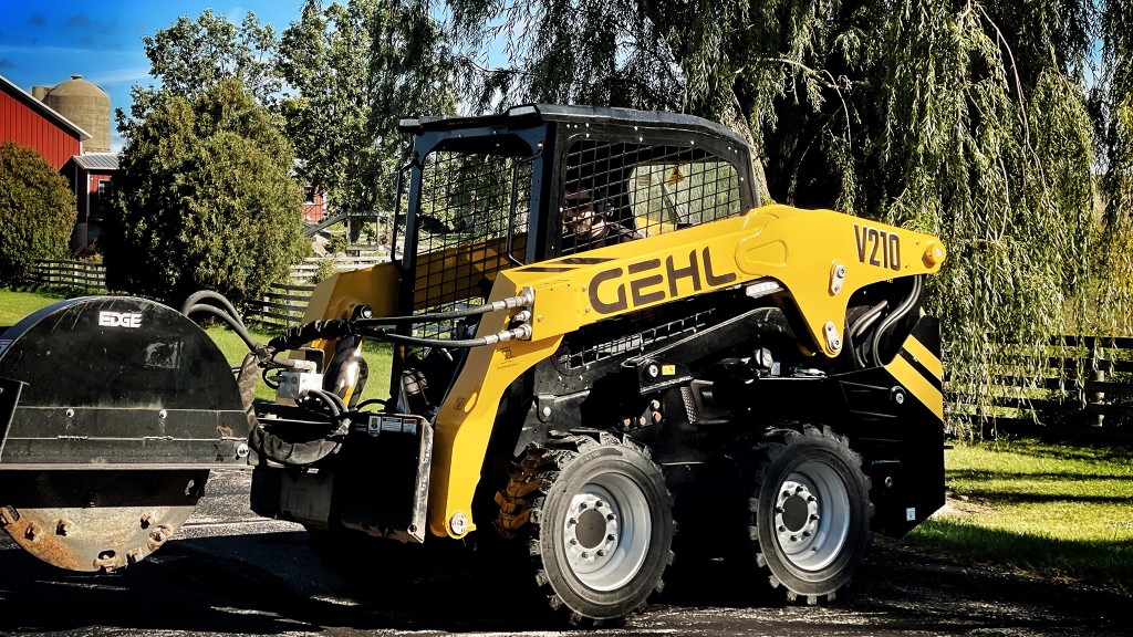 A skid-steer loader works on a roadbuilding project