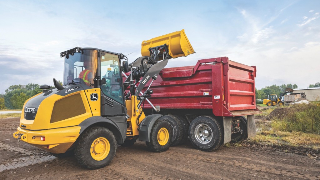 A wheel loader loading a dump truck.