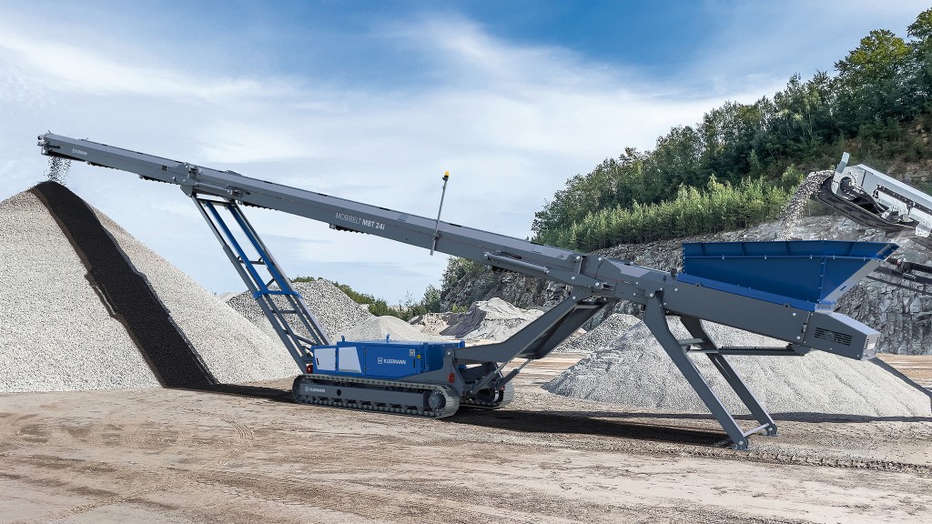 A mobile stacker next to an aggregate stockpile in a quarry.