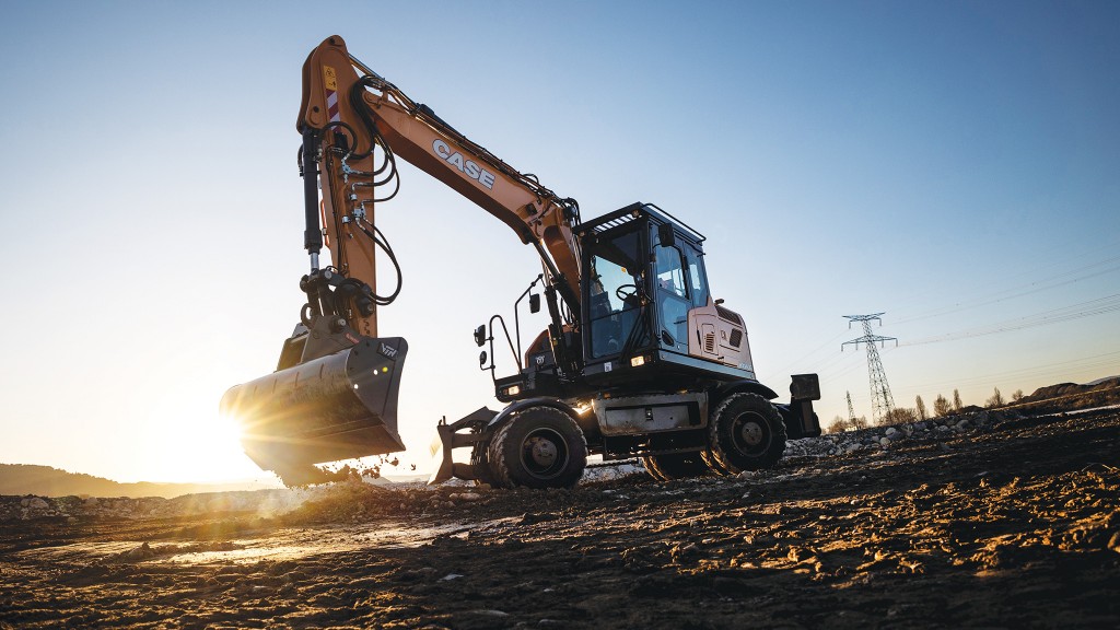 A wheeled excavator on a job site.