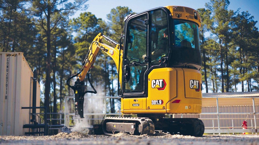 An electric mini excavator on a job site.