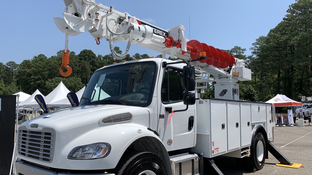 A mechanics truck equipped with an aerial lift.