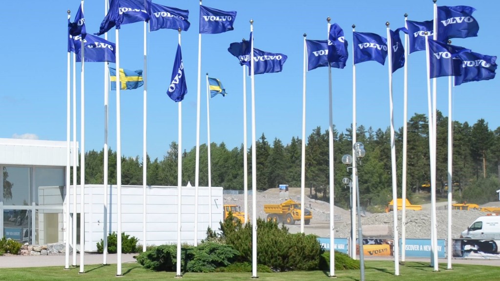 Flags fly outside of a Volvo CE building