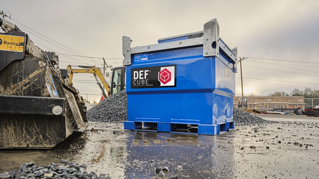 A cube-shaped portable fuel tank on a job site.