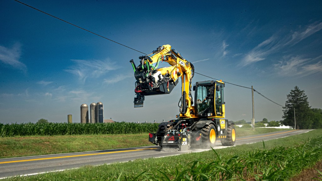 A pothole repair machine fixes a pothole on a road