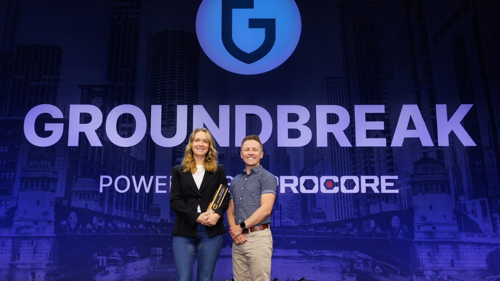 Jenna Burnet, Construction Manager, Interiors, and Jeffrey Laing, Quality Assurance Quality Control Manager accept the Groundbreaker Award for Burnaby, B.C.-based ETRO Construction.
