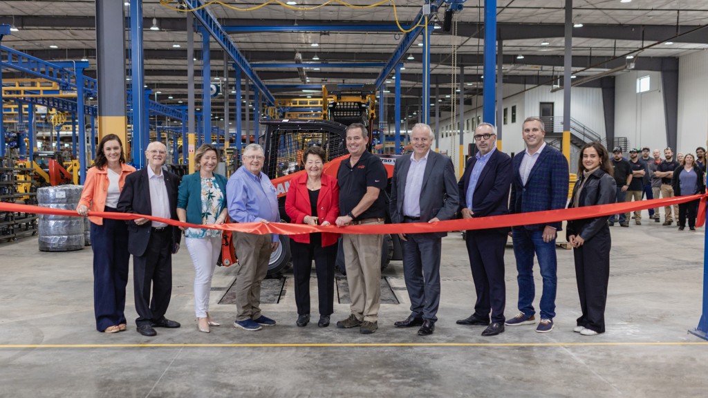 A ribbon cutting event at a manufacturing facility
