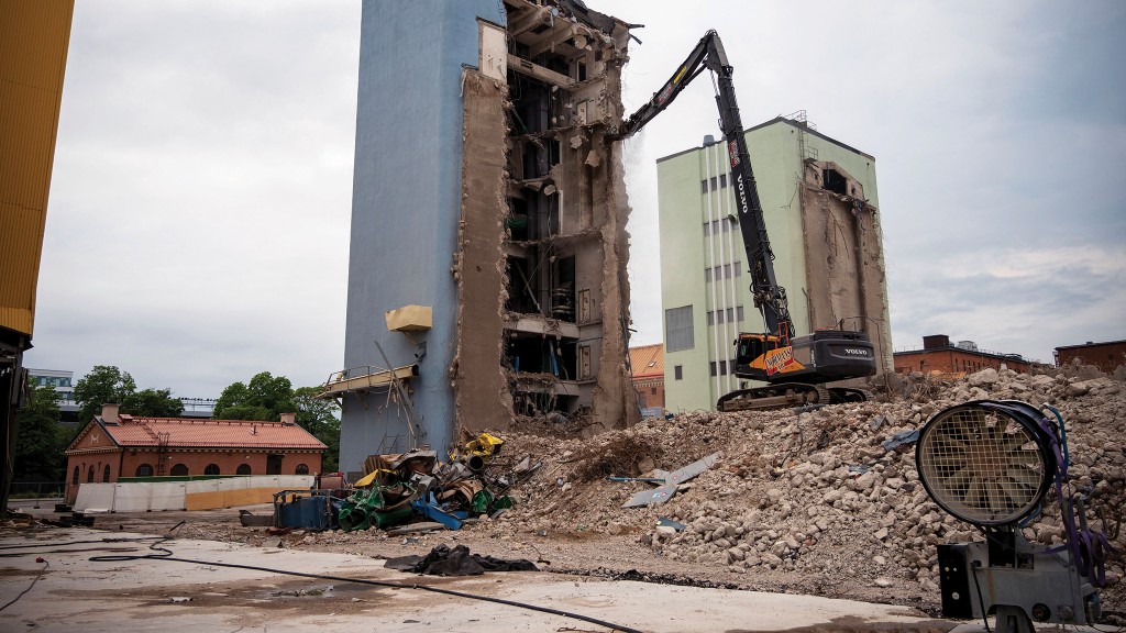 A demolition excavator utilizes a dust suppression system