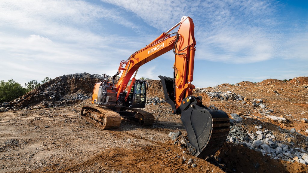 A hydraulic excavator digging on a job site.