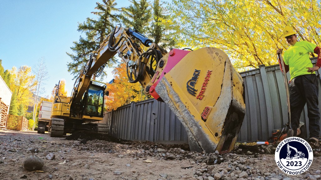 An excavator about to dig into the dirt