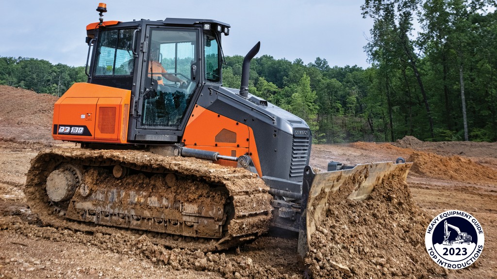 A dozer pushes dirt with its blade