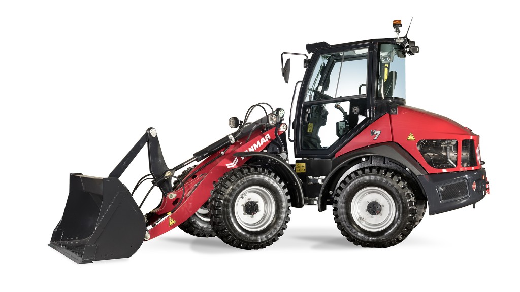 A compact wheel loader against a white background.