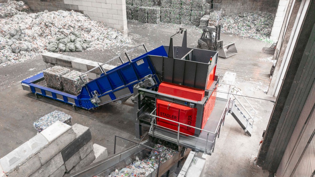 An automated bale wire remover removes bale wire in a recycling facility