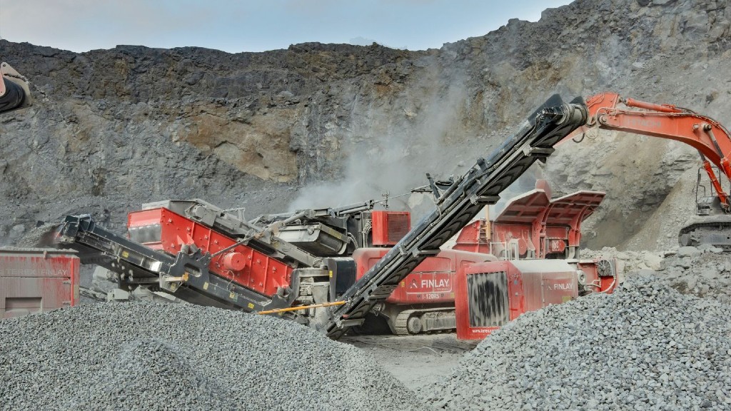 An electric impact crusher crushes material on a job site