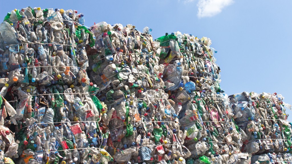 Bales of plastic are stacked in a large pile