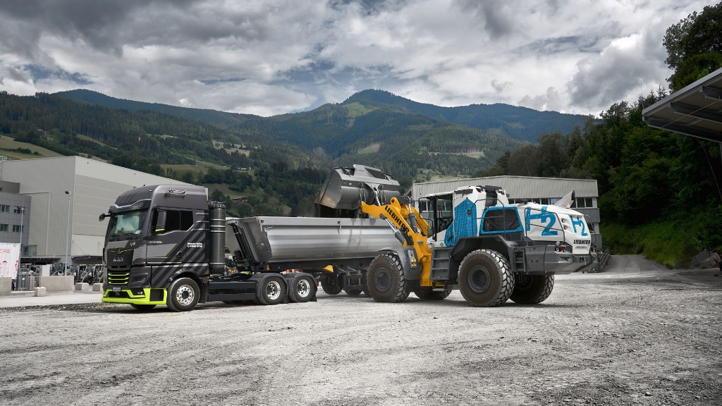 A wheel loader loads a truck with material