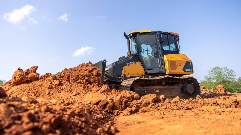 A dozer pushes dirt on the job site