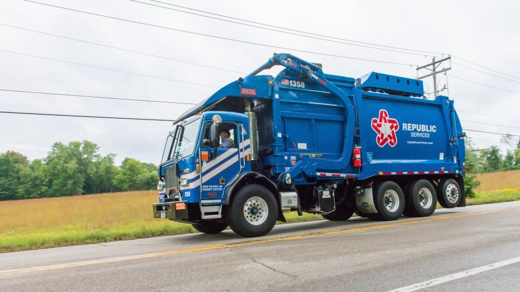 A Republic Services collection vehicle drives down a road