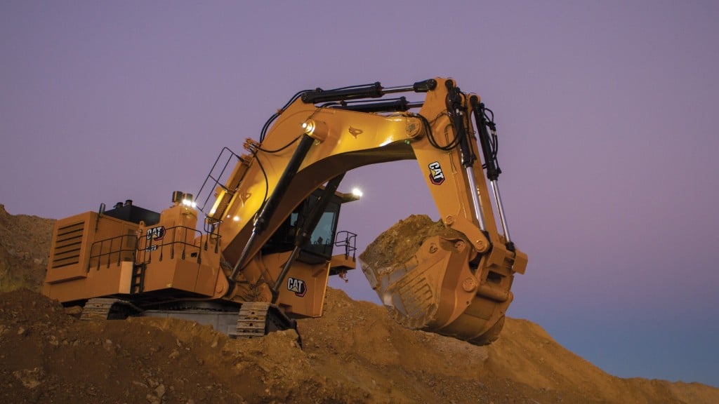 A hydraulic mining shovel transports earth in its bucket