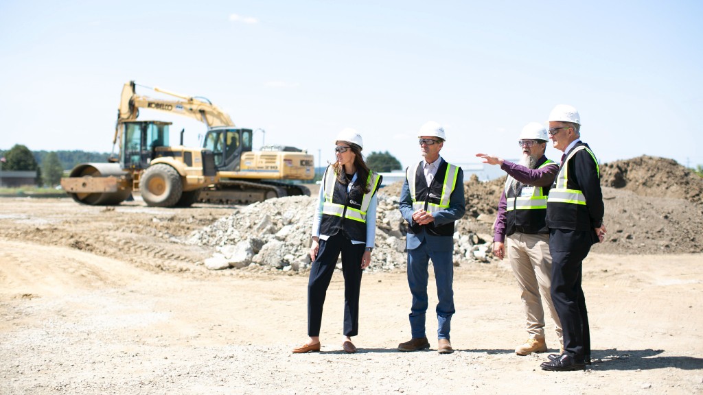 A group of people tour a construction site