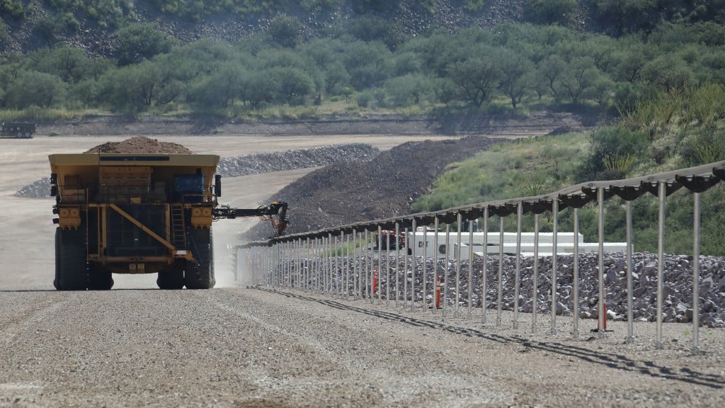 Cat mining truck drives powered by electric rail