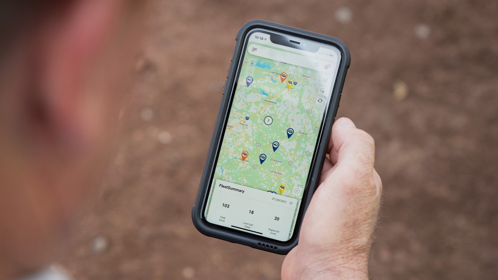 An operator reviews telematics data on a smartphone