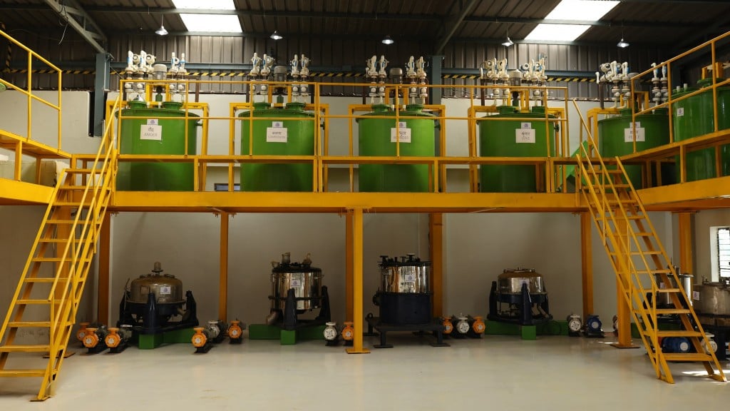 An interior view of an Ace Green Recycling modular recycling plant with large green  chambers on two levels