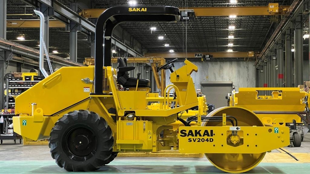A large yellow soil compactor A large yellow soil compactor