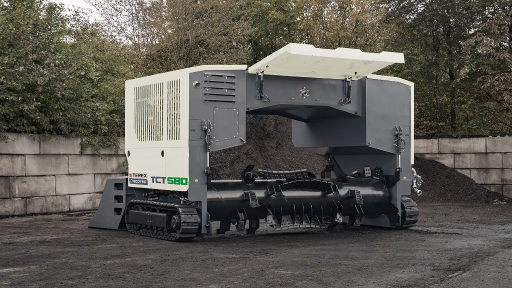 A large white windrow turner A large white windrow turner