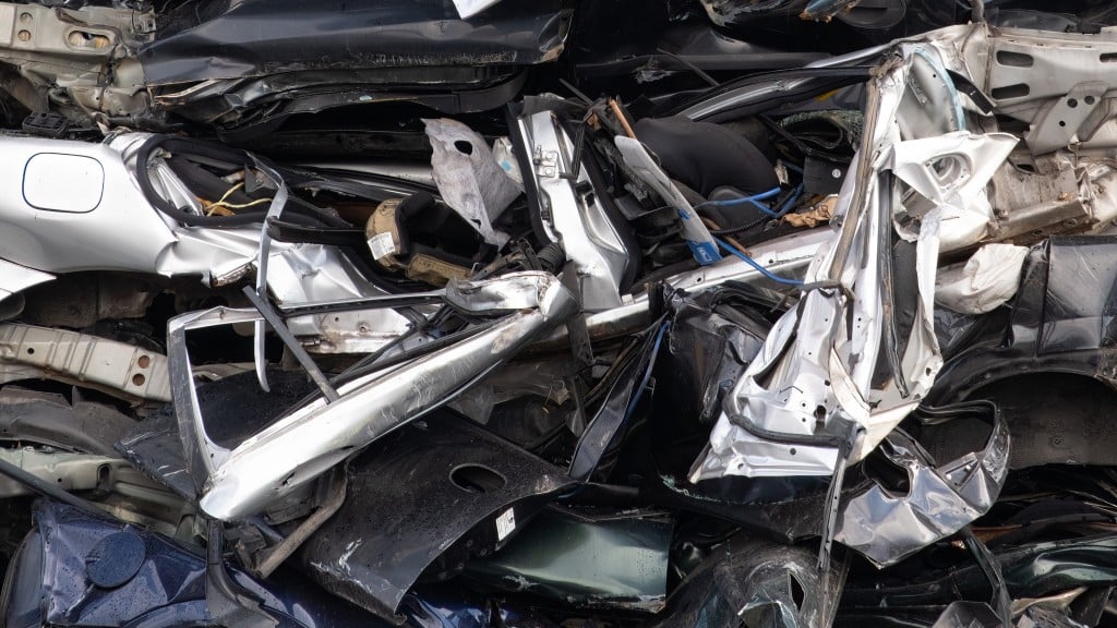 A pile of crushed cars. A pile of crushed cars.