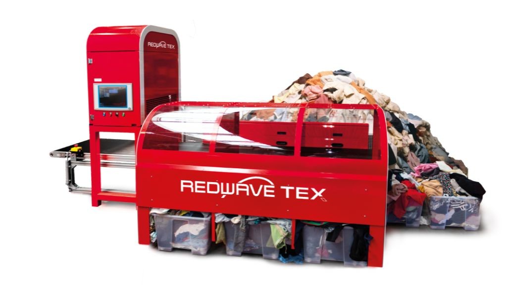 A large red textile sorting system on a white background A large red textile sorting system on a white background