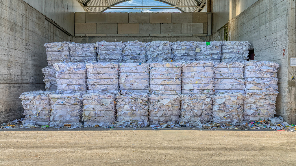 Several large bales of paper and cardboard Several large bales of paper and cardboard
