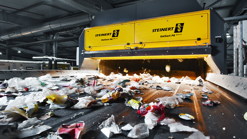 A STEINERT machine with materials being loaded on a conveyor belt