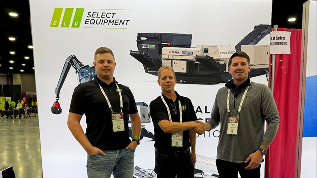Three men standing in front of an ELV Select Equipment sign shaking hands at a trade show Three men standing in front of an ELV Select Equipment sign shaking hands at a trade show