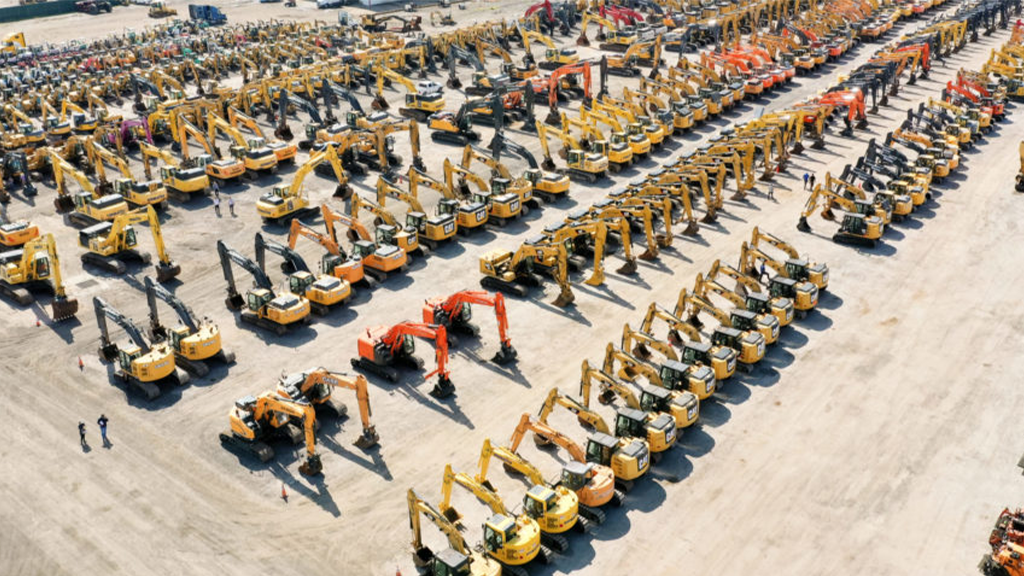 An aerial view of a large equipment yard filled with heavy machinery