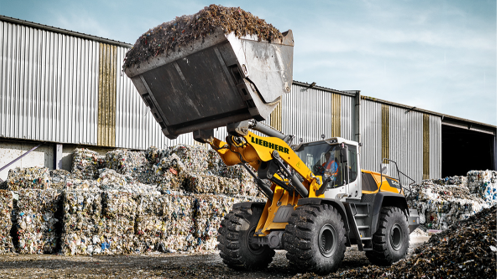 A wheel loader holding a bucket filled with material