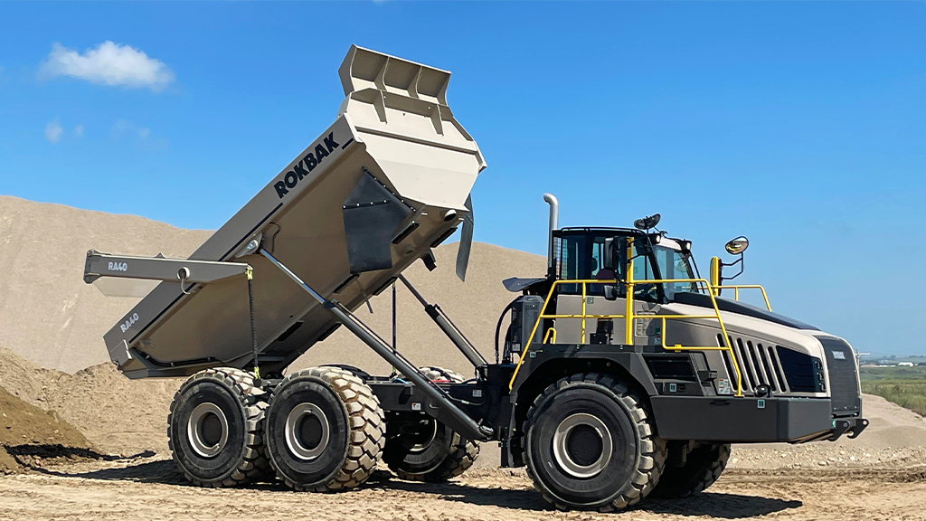 An articulated hauler with its bed extended