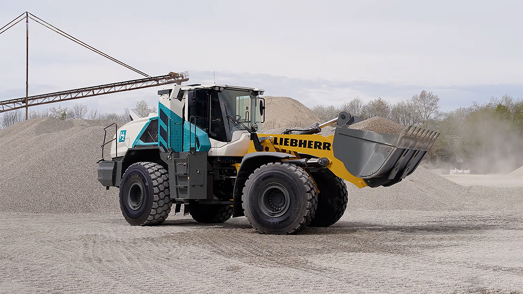 A blue wheel loader on a gravel site