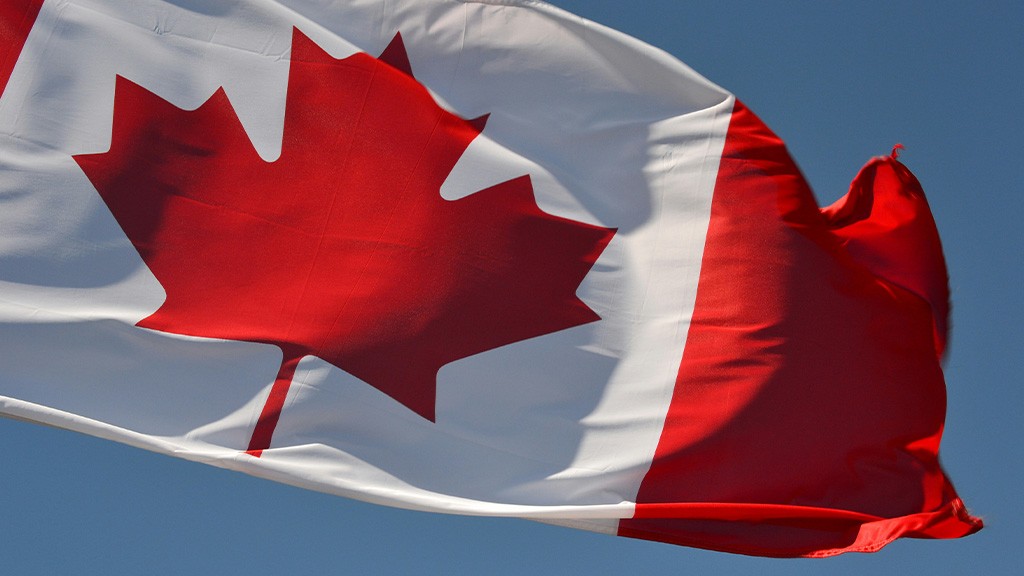 A close up image of a Canadian flag waving in the wind