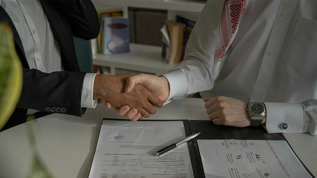 Two people shaking hands Two people shaking hands