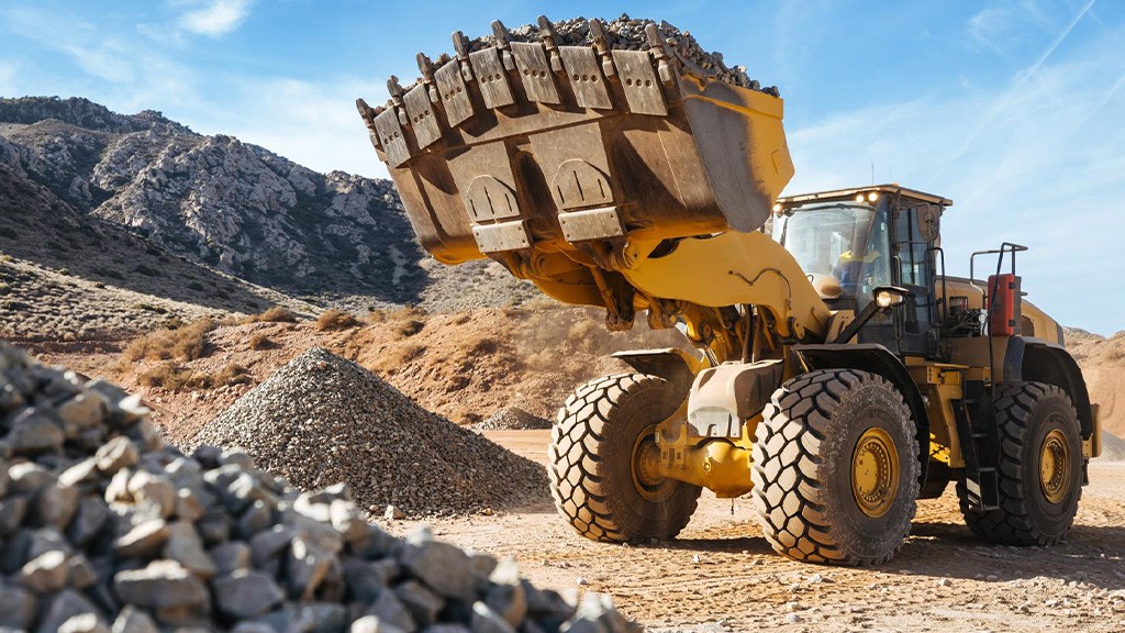 A wheel loader on an aggregate site fitted with large tires
