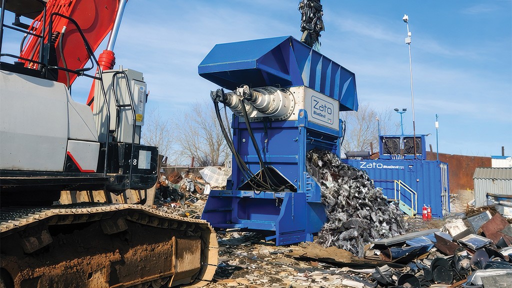 A shredder extrudes a stream of mixed materials